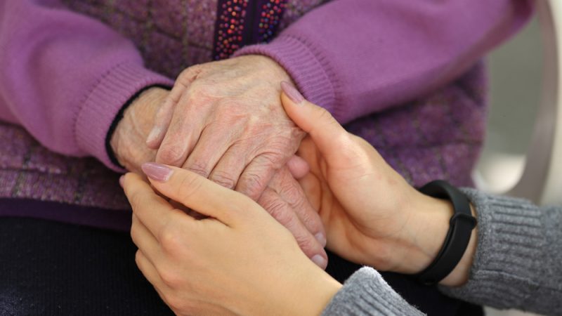 shutterstock_holding elderly hand